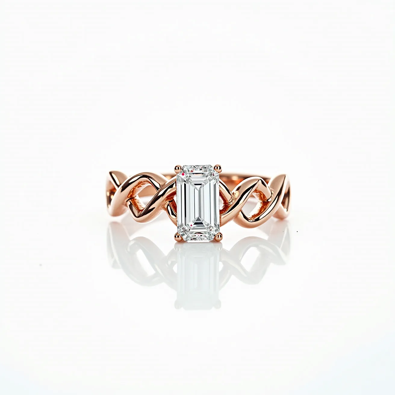 This diamond ring features a beautifully cut emerald diamond set in a four-prong setting, highlighting the stone's clarity and elegance. The band is crafted from rose gold, with an intricate twist design that adds a unique and modern flair to the classic solitaire style. The combination of the elongated, faceted diamond with the warm hue of the rose gold creates a striking contrast, enhancing the overall luxurious appearance of the piece. The detailing of the band provides a sophisticated yet contemporary aesthetic, making it a standout piece for any jewelry collection.