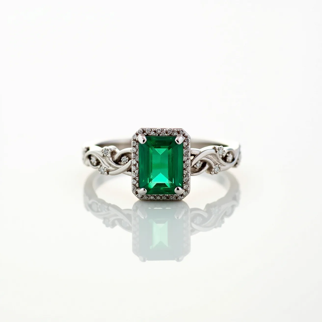 This emerald engagement ring features a striking emerald-cut emerald at its center, encircled by a halo of small, brilliant-cut diamonds. The emerald's rich green hue is accentuated by its rectangular cut, which offers a classic and refined appearance. The band is intricately designed with a twisting motif, adorned with additional small diamonds set into the curves, providing a delicate yet elegant contrast. The diamonds are likely securely set in prongs, ensuring stability and highlight their sparkle. The overall design is both ornate and balanced, with the emerald taking center stage.