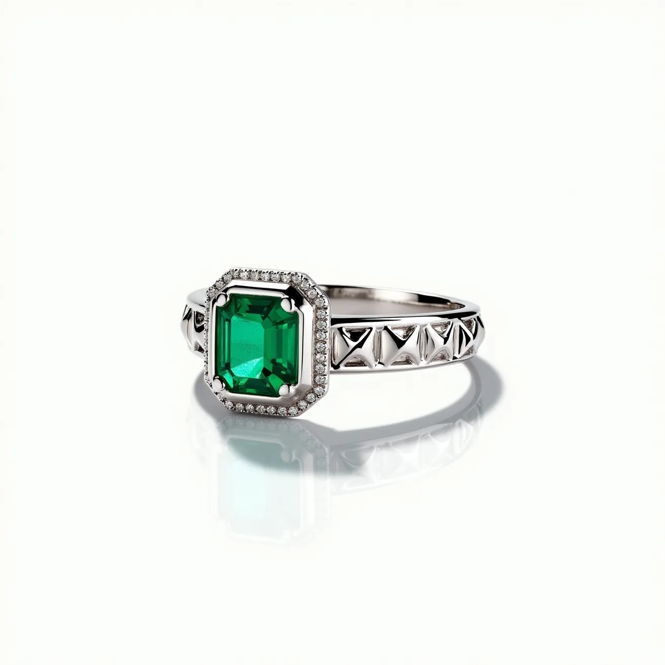 This emerald ring showcases a stunning square-cut emerald as the centerpiece, encapsulated within a bezel setting that enhances its vibrant green hue. Surrounding the emerald is a halo of small, intricately set round diamonds, adding a touch of brilliance and elegance. The band is crafted from polished white metal, likely white gold or platinum, featuring distinctive geometric engravings that add texture and character to the piece. These thoughtful design elements together create a harmonious blend of classic and contemporary styles, making this ring a captivating piece of jewelry.