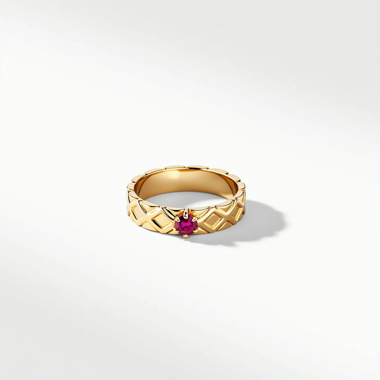 This eternity ring features a luxurious gold band with a quilted pattern that adds texture and elegance. At its center, a vibrant round-cut ruby is securely held in a prong setting, which enhances the gemstone's brilliance and rich red hue. The ring’s design is continuous, showcasing the precious metal and gemstone in a seamless, harmonious flow without any clasps or additional attachments, embodying the timeless symbolism of an unending circle.