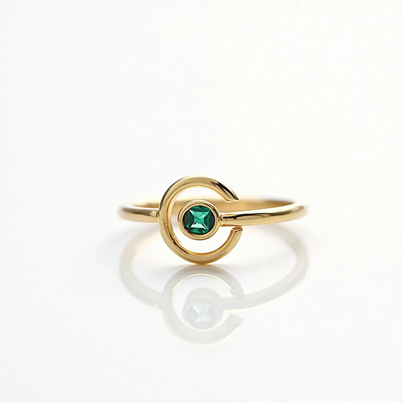 This fidget ring features a sleek, gold band with a central focal point designed for tactile interaction. At the heart of the ring is a striking green gem, cut in a square shape, which adds a touch of elegance to the design. The gem is securely held in place by a bezel setting that complements the band’s smooth finish. The open circle design around the gem not only enhances its visibility but also contributes to the ring’s fidget-friendly functionality, allowing gentle movement. The overall design combines style with a calming sensory experience, making it both a fashionable and functional accessory.