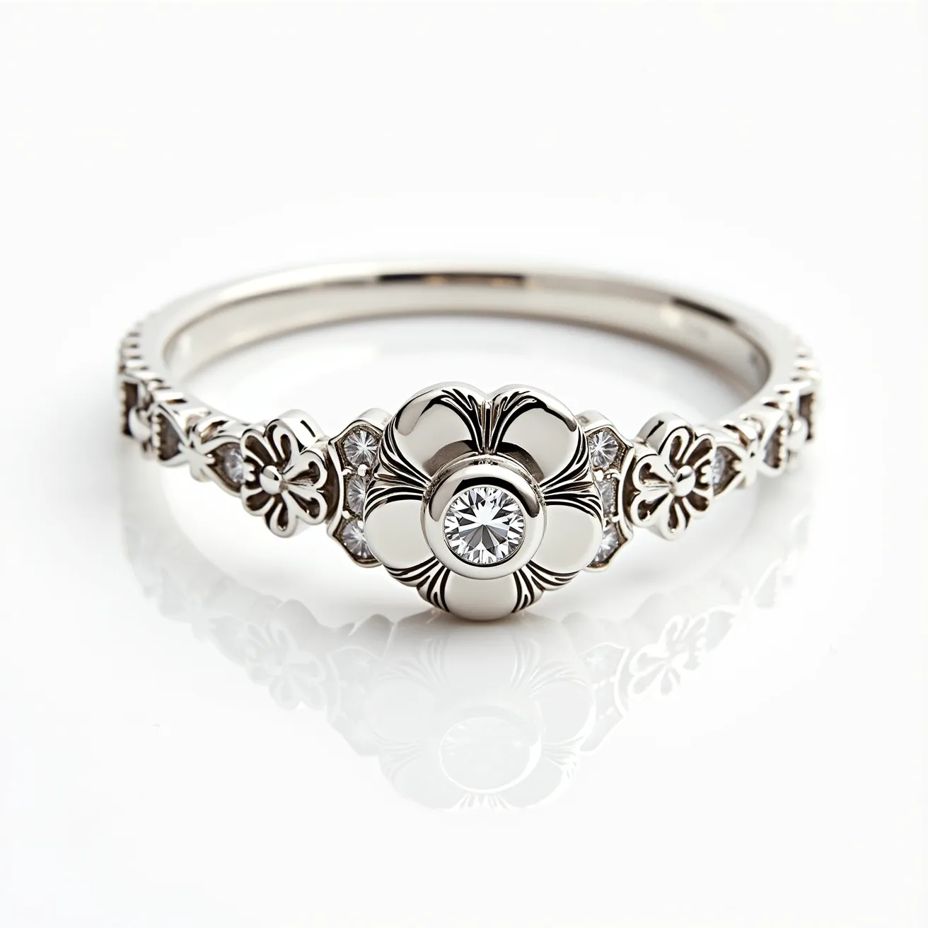 This floral ring features an elegant design with a central flower motif, beautifully crafted in silver or white gold. At the center of the flower is a round brilliant-cut diamond, securely set in a bezel setting, which adds sparkle and sophistication to the design. The band is adorned with smaller floral details and additional diamond accents that enhance its feminine charm and intricate craftsmanship. Each flower on the band appears to be intricately shaped, contributing to the overall floral aesthetic of the ring. The blend of precious metal and diamonds makes this piece not only visually captivating but also luxurious in its material composition.