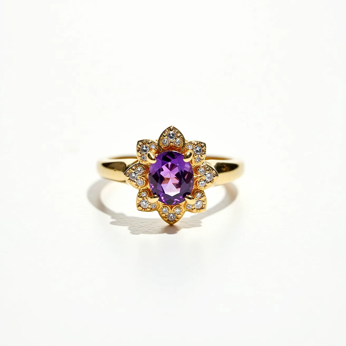 This floral ring features a central round-cut purple gemstone, likely an amethyst, which is elegantly set in a prong setting. Surrounding the central stone are smaller clear gemstones, possibly diamonds or cubic zirconia, each placed in a petal-like formation that enhances the floral motif of the piece. The band is crafted from gold, adding a warm and luxurious touch to the overall design. The setting appears secure, ensuring the stones are beautifully displayed and protected. The bright contrast between the gold band and the colorful stones creates a striking visual appeal.