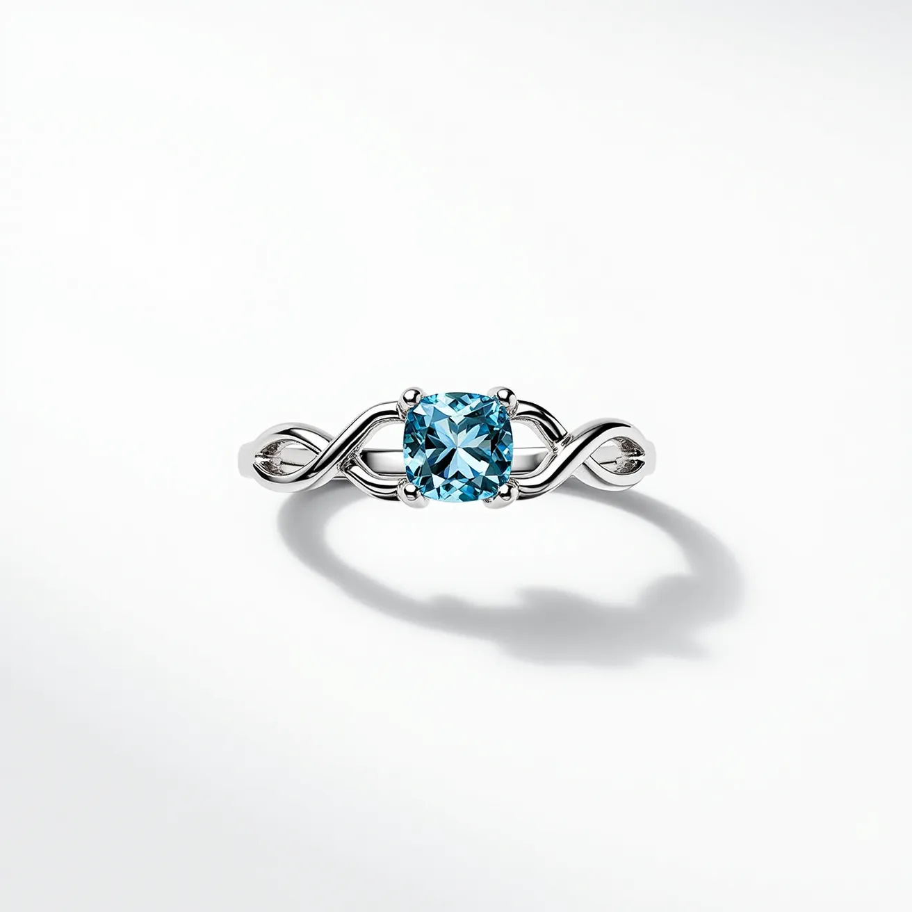 This friendship ring features a delicate design crafted from a polished silver material. At its center, there is a beautifully cut blue gemstone with a square cushion cut, set in a four-prong setting that securely holds the gem in place. The band showcases an elegant infinity motif, symbolizing eternal friendship, which seamlessly integrates with the setting of the gemstone, adding flair and symbolic value to its overall aesthetic.