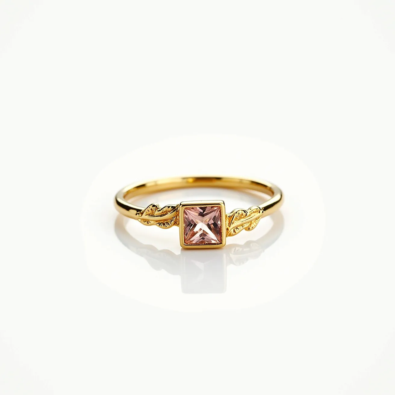 This friendship ring features a gold band with a prominent square-cut pink gemstone at its center, set in a bezel setting. The gemstone is accentuated by delicate, leaf-like designs on either side, adding an elegant touch to the overall design. The gold band complements the warm hue of the gemstone, creating a harmonious aesthetic. There are no additional clasps or attachments, allowing the ring to maintain a sleek and unobtrusive profile.