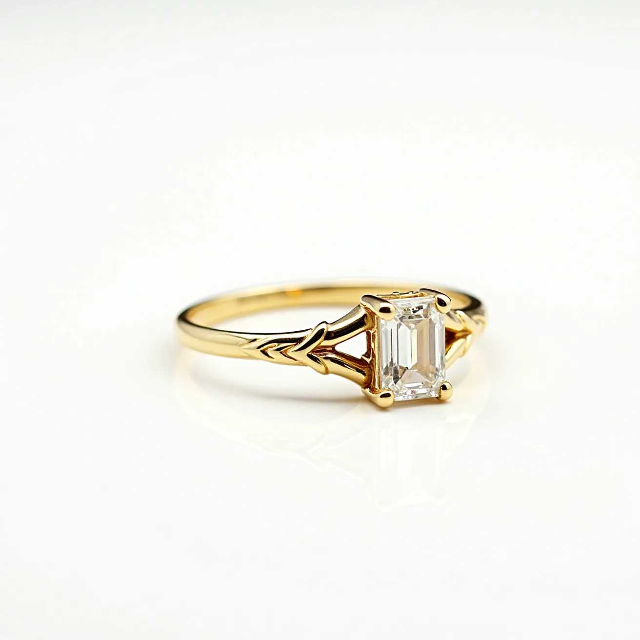 This gold wedding band features an elegant and traditional design, crafted from yellow gold. It prominently showcases an emerald-cut diamond as its centerpiece, which is securely held in place by a four-prong setting. The prongs are a continuation of the intricate detailing on the band, which includes delicate arrow-like patterns that add a unique touch to the overall aesthetic. There is no clasp or additional attachment, maintaining a simple yet classic style suitable for a wedding band.