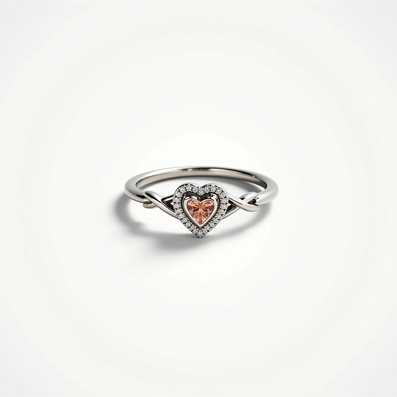 This heart promise ring features a delicate band crafted from a polished metal, likely a silver or white gold, enhancing its elegant appearance. At its center, the ring showcases a heart-shaped gemstone in a soft, pinkish hue, perfectly set within a halo of sparkling, small clear stones that highlight its romantic design. The heart gemstone appears to be faceted, maximizing its brilliance and charm. The band is adorned with a graceful knot or twist detail on each side, adding a touch of uniqueness to its classic style. The overall design embodies both simplicity and elegance, making it a meaningful symbol of love and commitment.