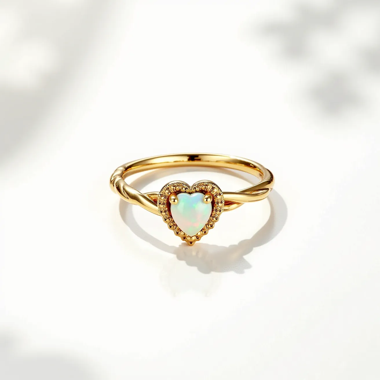 This heart promise ring features a delicate gold band with a central heart-shaped opal as its focal point. The opal is set in a bezel setting surrounded by small, sparkling diamonds that form a halo, enhancing its iridescent colors. The band itself has a twisted design, adding a unique touch to the ring's classic elegance. The setting securely holds the gemstone, ensuring it sits prominently and catches the light beautifully.