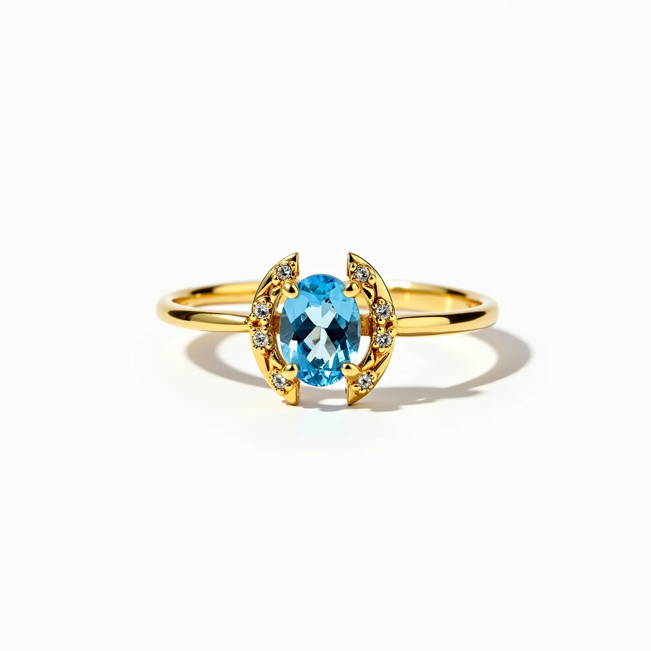 This horseshoe ring features a striking design with a prominent oval-cut blue gemstone at its center, set in a gold band. The blue gemstone is flanked by a series of sparkling smaller gems, likely diamonds, that accentuate the horseshoe shape. These smaller gems are round in cut and are securely set along the curved gold edges of the horseshoe. The polished gold band enhances the overall elegance, creating a stunning visual contrast with the vibrant blue of the central stone. The design of the ring does not include any visible clasp or additional attachments, focusing purely on the seamless integration of the stones and the band.