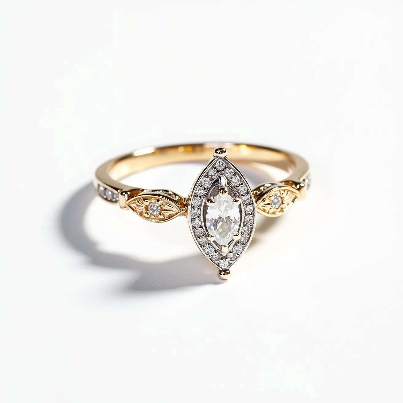 This marquise diamond ring features a central marquise-cut diamond set in a halo of smaller round diamonds, emphasizing its elongated shape. The band is crafted from gold, accentuated by two smaller marquise-shaped settings on either side of the central stone, each housing a single round diamond. The band is detailed with additional small diamonds, enhancing the ring's overall sparkle and elegance. The design showcases a classic yet intricate setting, blending the allure of the primary gemstone with complementary accent stones.