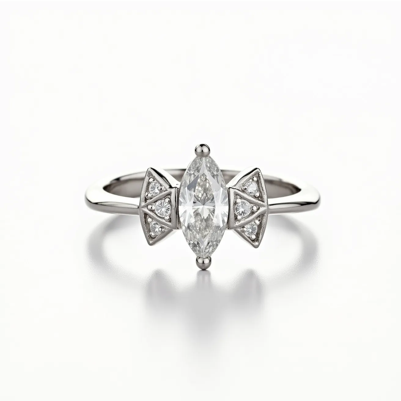 This marquise diamond ring features a central marquise-cut diamond set in a sleek metal band, likely platinum or white gold. The marquise stone is flanked by two geometric settings adorned with smaller round diamonds, adding a touch of elegance and symmetry to the design. The side diamonds are arranged in triangular clusters on either side of the main stone, enhancing the overall brilliance and sophistication of the piece. The band is smooth and polished, ensuring a comfortable fit. The design showcases a blend of classic and modern aesthetics, making it a striking accessory.