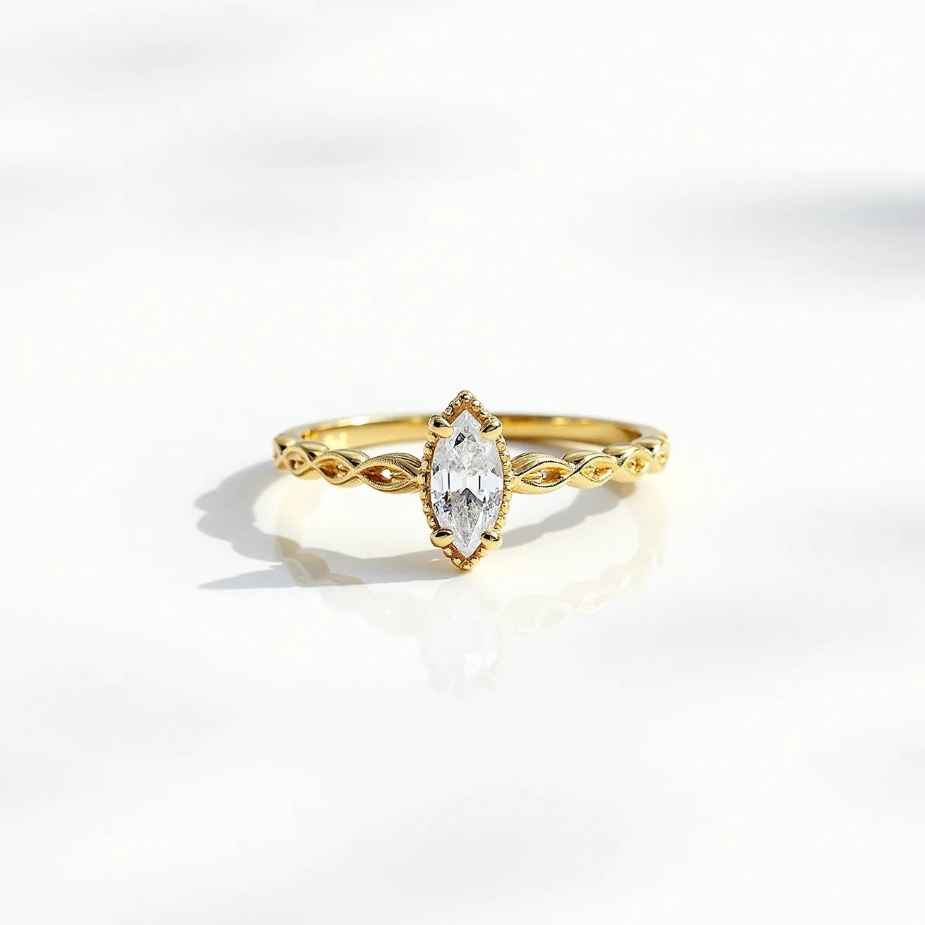 This marquise engagement ring features an elegant marquise-cut diamond as its centerpiece, set in a delicate gold band. The diamond is securely held in place with a bezel setting, which compliments its elongated, pointed shape. The band showcases an intricate twisted design, adding a touch of sophistication and uniqueness to the piece. Crafted from polished gold, the band complements the brilliance of the diamond, creating a timeless and luxurious look.