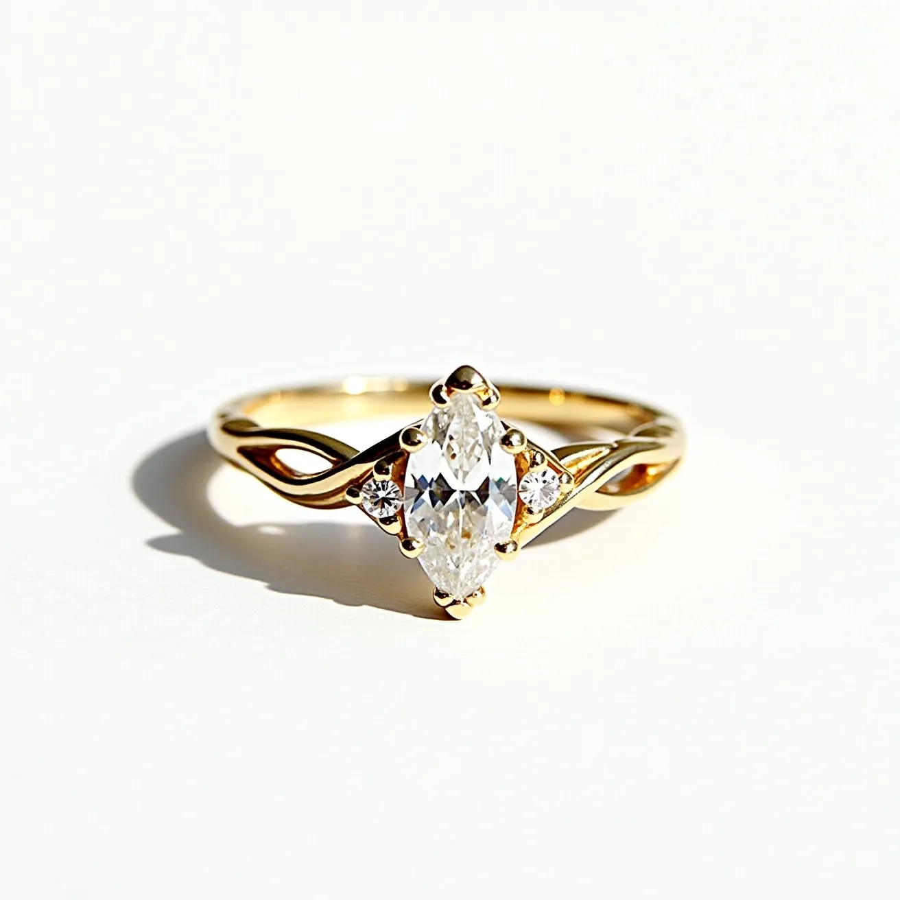 This marquise engagement ring features a marquise-cut diamond as the centerpiece, elegantly set in a bezel of gold, which enhances its elongated shape and brilliance. Flanking the central diamond are two smaller round diamonds, adding a touch of sparkle and sophistication to the design. These side stones are also set in gold, harmoniously complementing the central stone. The band is crafted from polished gold, creating a smooth and luxurious appearance that complements the bright luster of the diamonds. The band has an open, twisted design that adds an intricate and stylish touch to the overall aesthetic of the ring.