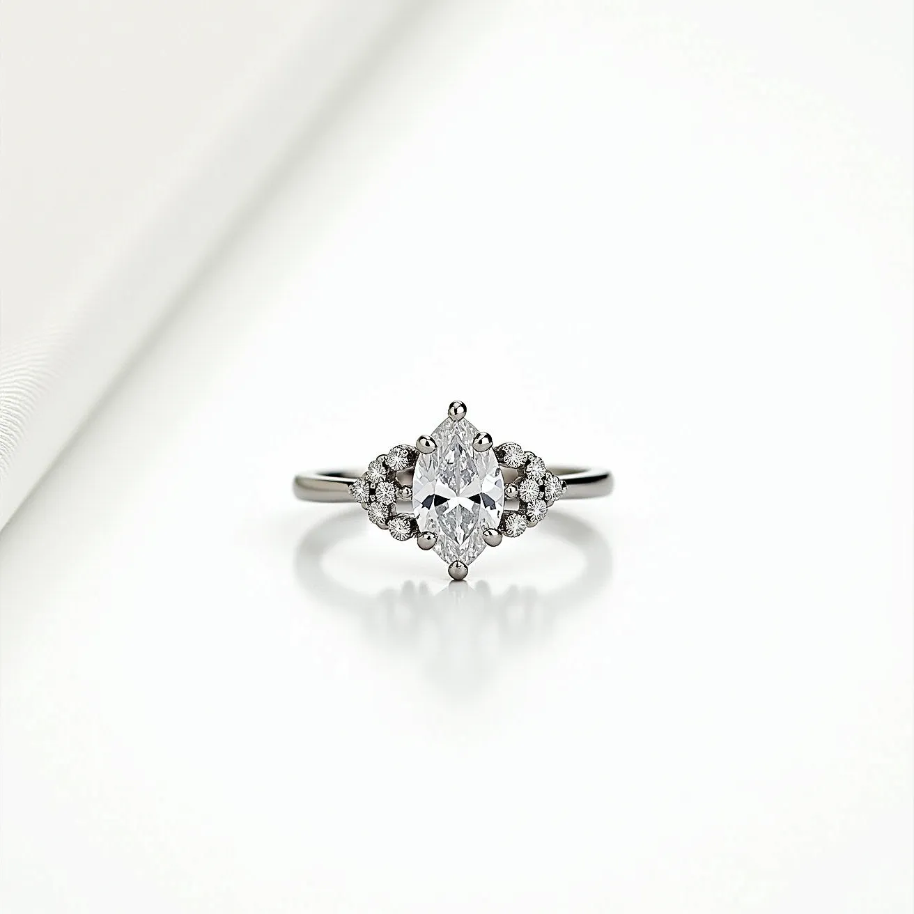 This marquise engagement ring features a center marquise-cut diamond, elegantly set in a prong setting. The central stone is flanked by a cluster of smaller round diamonds on either side, adding brilliance and enhancing the overall sparkle. The band is crafted from polished white gold, complementing the clarity and shine of the diamonds. The arrangement of the stones and the choice of materials exude a classic yet sophisticated elegance.