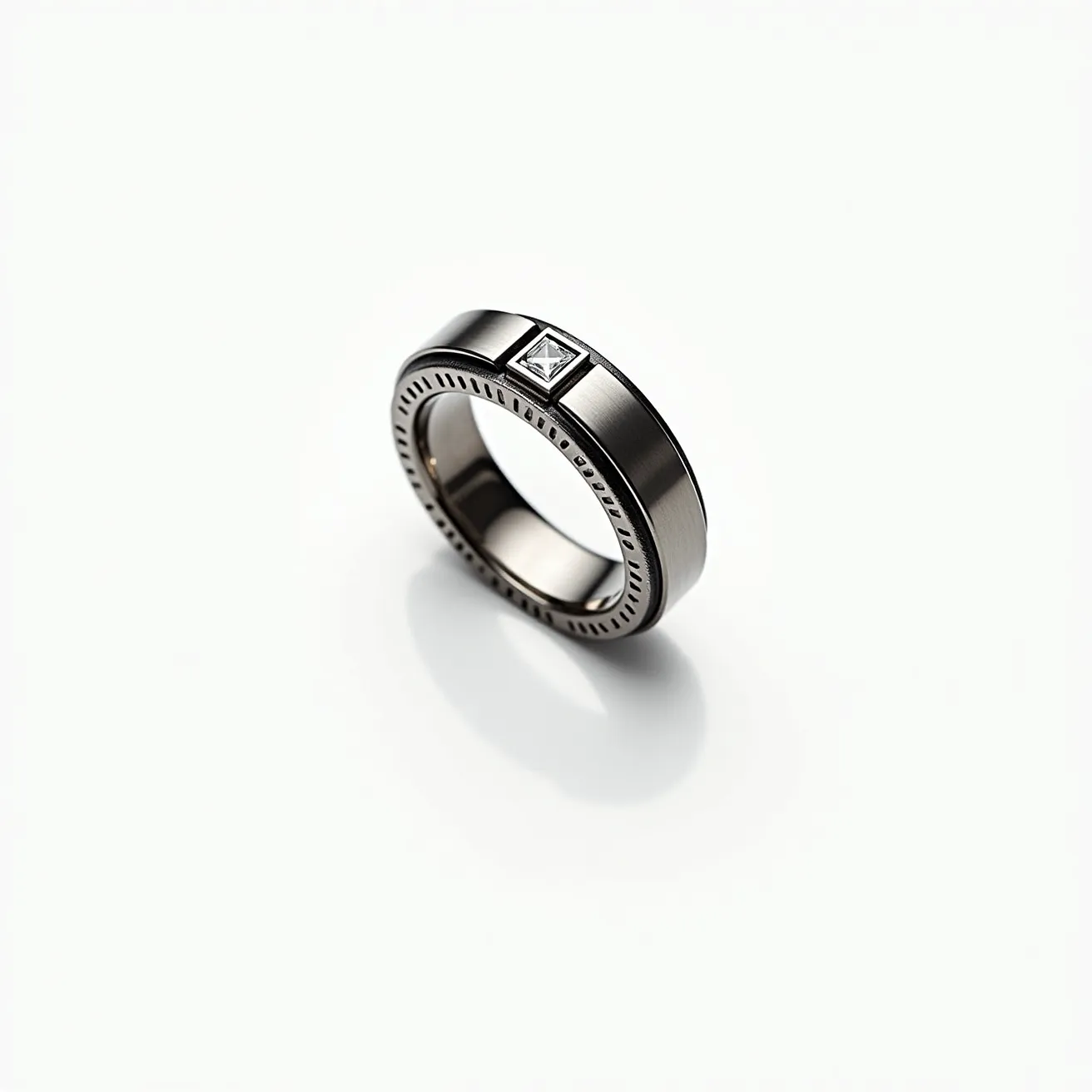 This men's ring showcases a sleek and modern design, crafted from a high-shine metal that appears to be a durable stainless steel or titanium, known for their ruggedness and smooth finish. The band is adorned with a square-cut gemstone, likely a diamond, centrally set in a bezel setting which adds to its contemporary aesthetic. Around the edge of the band, there is a subtle, yet stylish, pattern that gives the ring an added character and texture. The overall appearance is minimalist yet sophisticated, offering a versatile accessory suitable for various occasions.