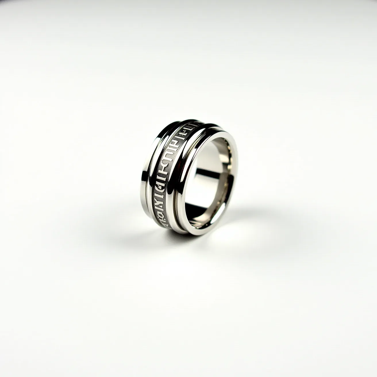 This men's spinner ring displays a sleek design crafted from what appears to be stainless steel, featuring a central band with engraved text in a contrasting finish. The ring's outer portion rotates, characteristic of spinner rings, and provides a tactile and visual distinction against the polished edges. The absence of gems or additional adornments emphasizes the textual element, while the durable material ensures longevity. The smooth inner band offers comfort, enhancing its wearability.