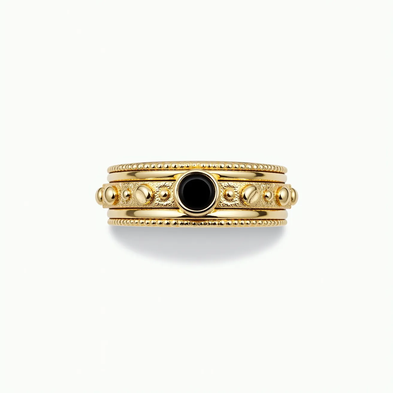 This men's spinner ring is crafted from gold-toned metal, featuring a central band enhanced with a smooth black stone. The stone is round and set in a secure bezel setting, providing a sleek and polished look. The ring's design incorporates ornate circular details on either side of the black stone, lending it an intricate and eye-catching appearance. Its edges are adorned with fine beaded accents, adding texture and depth to the overall design. No clasp or attachment is present, indicating it is a continuous band suitable for frequent wear.