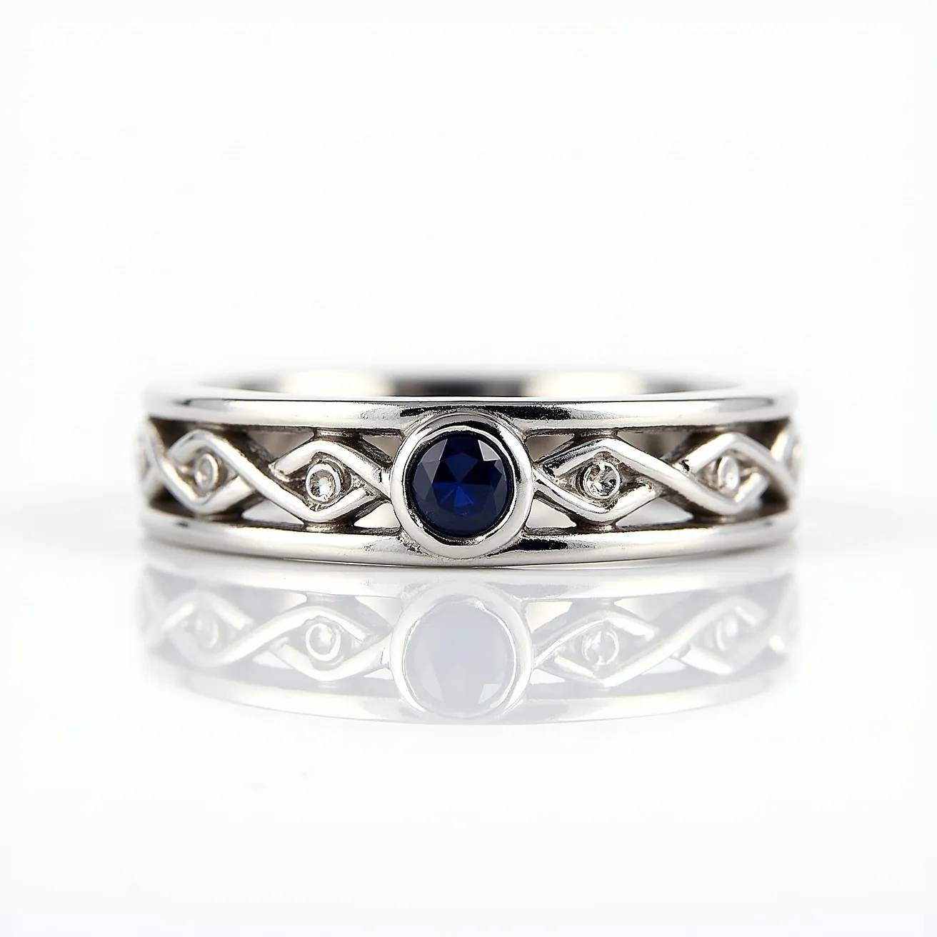 This men's wedding band is crafted from a polished metal, likely white gold or platinum, featuring an intricate design with an alternating pattern of gemstones set into the band. The central focus is a round, deep blue sapphire, bezel-set for a sleek, smooth finish. Surrounding the sapphire are smaller, round-cut diamonds, each delicately set in a subtle prong or bead setting that enhances the band’s elegance. The interwoven design adds a decorative and refined touch, complementing the overall aesthetic without requiring any additional clasps or attachments.