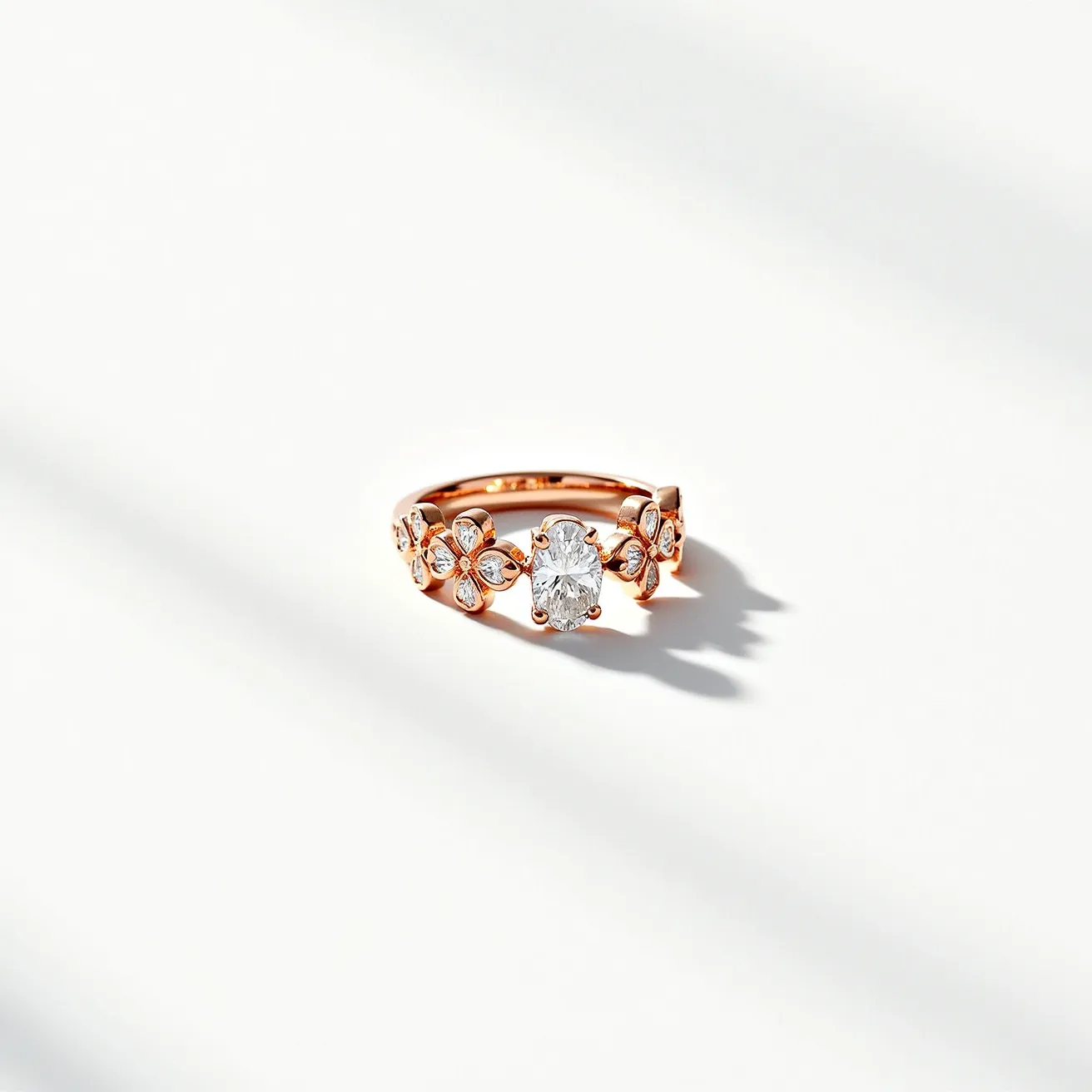 This midi ring is crafted from what appears to be rose gold, featuring an ornate floral design. The band is adorned with small, round-cut diamonds set into flower shapes, emphasizing an elegant and intricate aesthetic. At the center, the ring showcases a larger, oval-cut diamond set prominently in a prong setting, enhancing its brilliance and significance. The craftsmanship highlights meticulous attention to detail, with the combination of gemstones and metal creating a harmonious and refined piece.