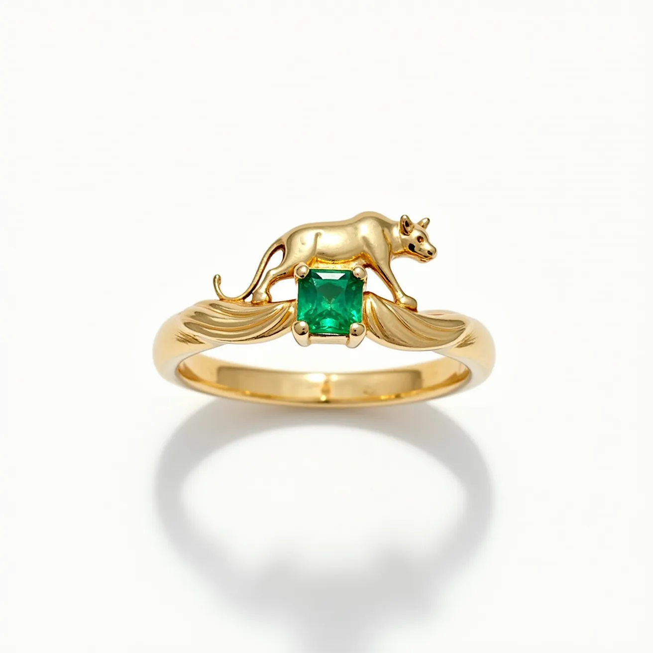 This midi ring features a whimsical design crafted from gold, showcasing a highly polished finish. At its center, a vibrant green square-cut gemstone is held securely in a prong setting, drawing attention with its rich hue. The ring's standout feature is a detailed sculpture of a small animal, elegantly perched above the gemstone, adding a playful character to the piece. The band is smoothly curved, enhancing the overall grace of the design, and it seamlessly encircles the finger without any visible clasps or attachments.