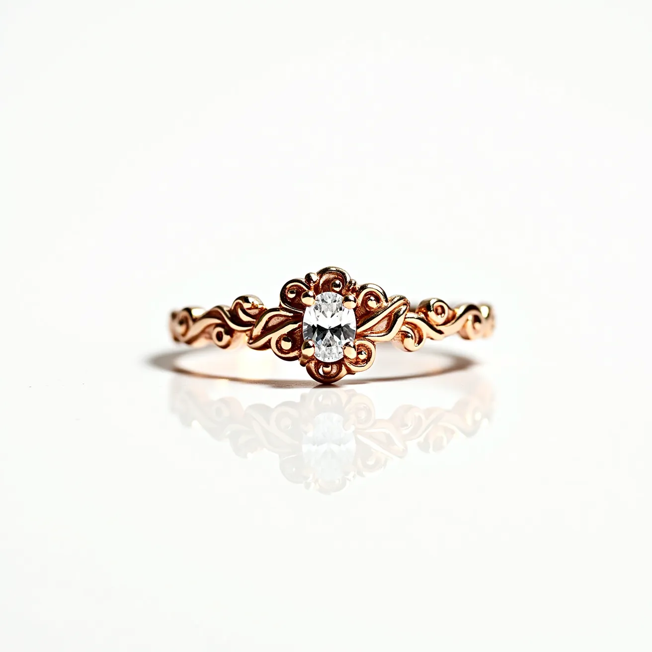 This moissanite promise ring features a central oval-cut moissanite stone set in an intricately designed band. The band is crafted from rose gold, showcasing an elegant pattern of swirls and leaves that enhance the ring's delicate and romantic appearance. The moissanite is securely held by four prongs, ensuring stability and allowing light to enhance its brilliance. The detailed craftsmanship of the band adds a vintage charm, making it a meaningful piece for special commitments.