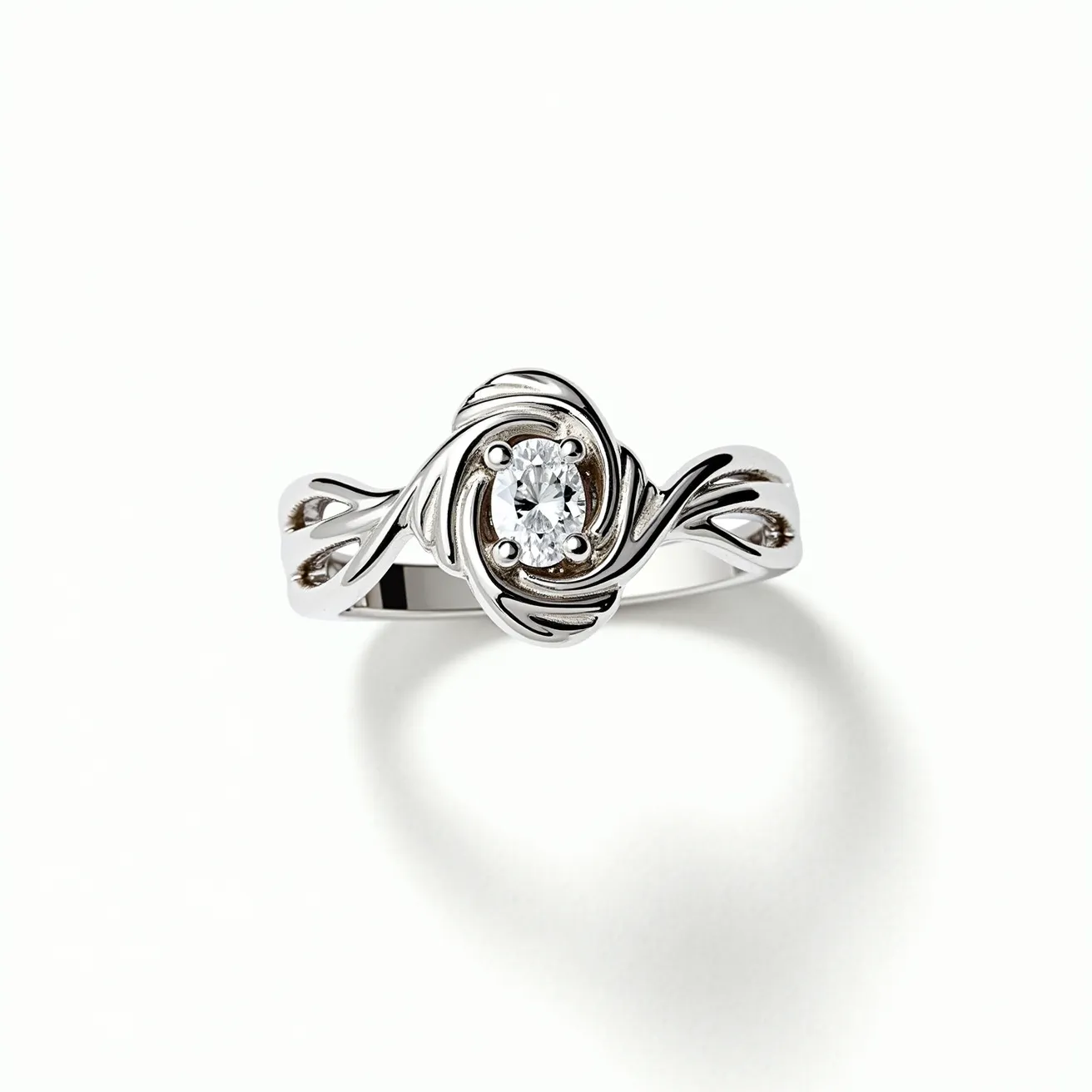 This moissanite ring features a central oval-cut moissanite gemstone set in an elegant swirl design. The setting, likely crafted from a polished metal such as white gold or platinum, gracefully wraps around the stone, enhancing its brilliance. The band showcases intricate detailing, adding a touch of sophistication to the overall design. There are no additional clasps, as the ring design relies on the secure prong setting of the moissanite for stability and beauty.