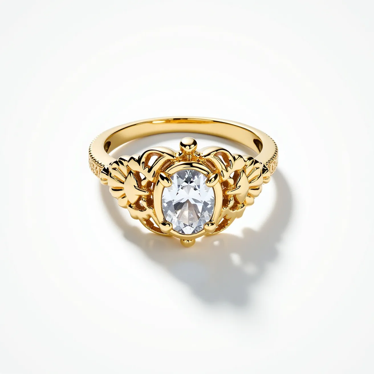 This moissanite ring features a central oval-cut moissanite gemstone, which is known for its exceptional brilliance and fire. The gemstone is securely set within an ornate gold band, showcasing intricate detailing on either side of the stone. The design incorporates delicate embellishments, contributing to a graceful and elegant appearance. The band itself is polished and appears to be made of high-quality gold, enhancing the overall luxurious aesthetic. The setting and craftsmanship suggest a piece of jewelry designed to be both beautiful and enduring.