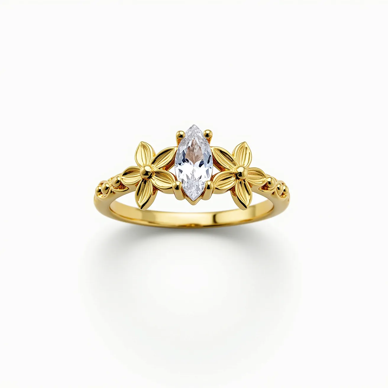 This mother's ring features a marquise-cut gemstone set in the center, showcasing its brilliance and elegance. The band is crafted from yellow gold and is adorned with intricate floral motifs on either side of the central stone, adding a touch of nature-inspired beauty. The marquise stone is secured in a prong setting, which enhances its visibility and sparkle. The craftsmanship reflects a delicate balance of sophistication and sentimentality, making it a meaningful piece.