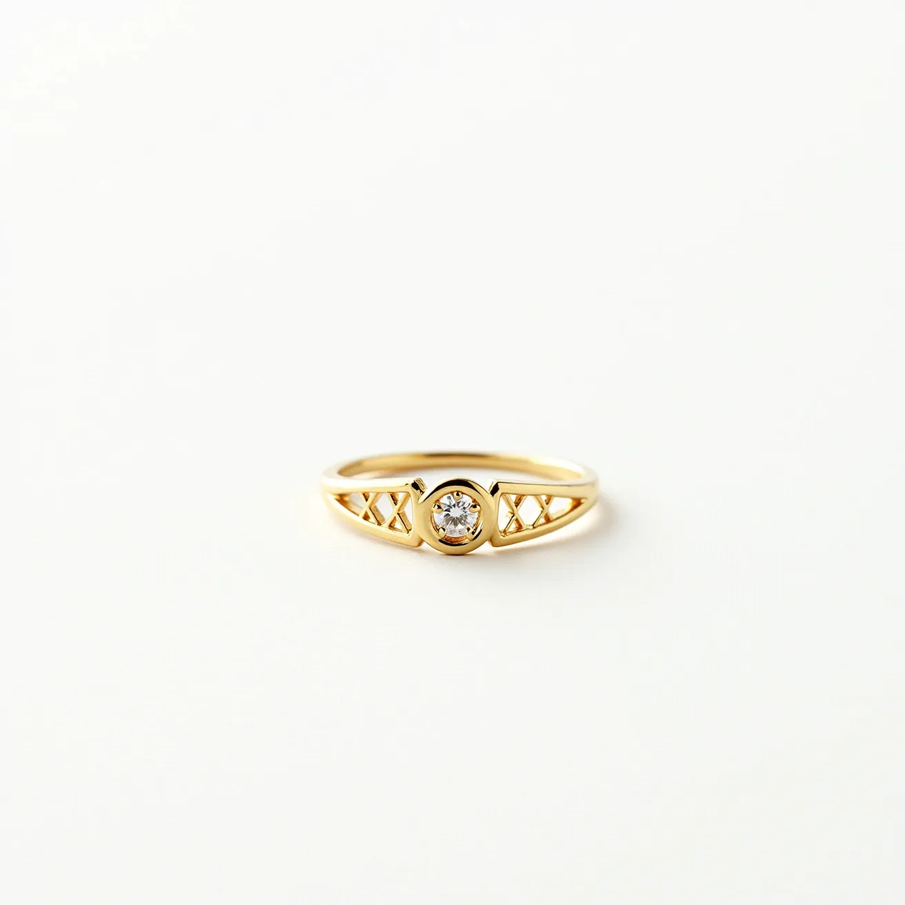 This mothers ring features a sleek design crafted in gold, showcasing a central round-cut diamond set in a bezel setting. The band incorporates a geometric pattern with openwork detailing on either side of the gemstone, adding an elegant and unique touch. The craftsmanship reflects a blend of simplicity and sophistication, making it a meaningful piece. The ring doesn't include any clasps or additional attachments, maintaining a classic silhouette.