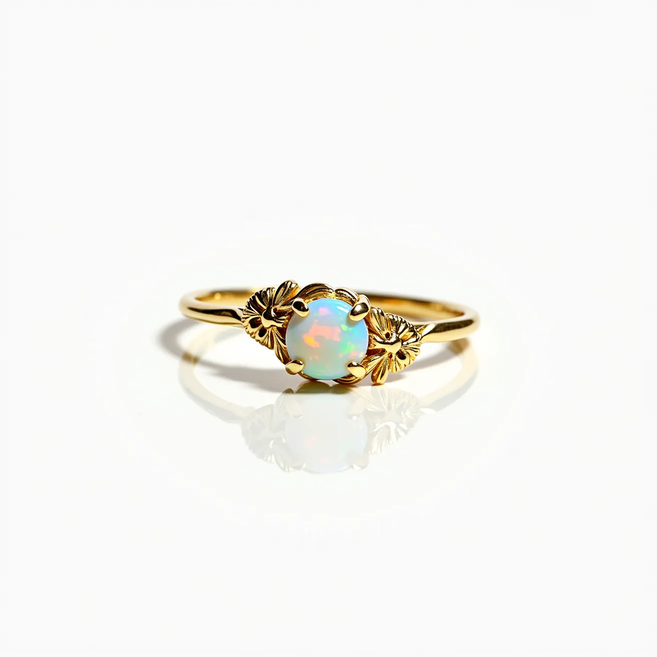 This opal ring features a central, round opal stone displaying a captivating play of colors, primarily blue and orange hues. The opal is set in a classic claw setting, secured by four prongs that hold it gracefully in place. The band of the ring is crafted from gold, adding a luxurious touch to the overall design. On each side of the opal, there are intricately designed gold leaf accents, enhancing the elegance and organic feel of the piece. The combination of the vibrant opal and the refined gold detailing makes this ring a striking and sophisticated accessory.