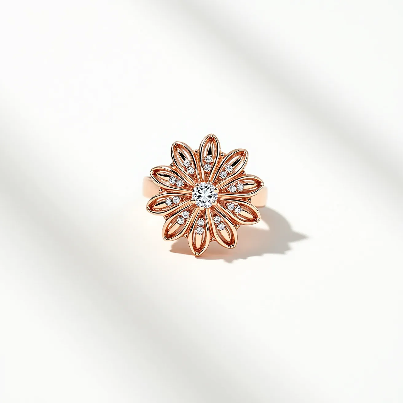 This pave ring showcases a captivating floral design crafted from rose gold, featuring an exquisite central round-cut diamond set in a prong setting. Surrounding the central stone, smaller diamonds are artfully placed in a pave setting to enhance the floral motif's petals, reflecting both elegance and intricacy. The warm hue of the rose gold provides a striking contrast to the brilliance of the diamonds. The band is smooth and polished, complementing the elaborate design on the top without any additional clasps or attachments. This ring is an embodiment of craftsmanship and sophisticated design.