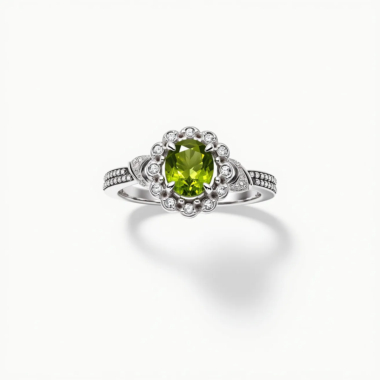 This peridot engagement ring features a vibrant oval-cut peridot as its centerpiece, set in a polished white metal band, likely platinum or white gold. Surrounding the central stone is a halo of round-cut diamonds, adding brilliance and enhancing the overall sparkle. The band is further adorned with additional small diamonds along its shoulders, contributing to the ring’s elegant and luxurious appearance. The craftsmanship showcases intricate detailing in the metalwork and a secure prong setting for the peridot, ensuring both style and stability.