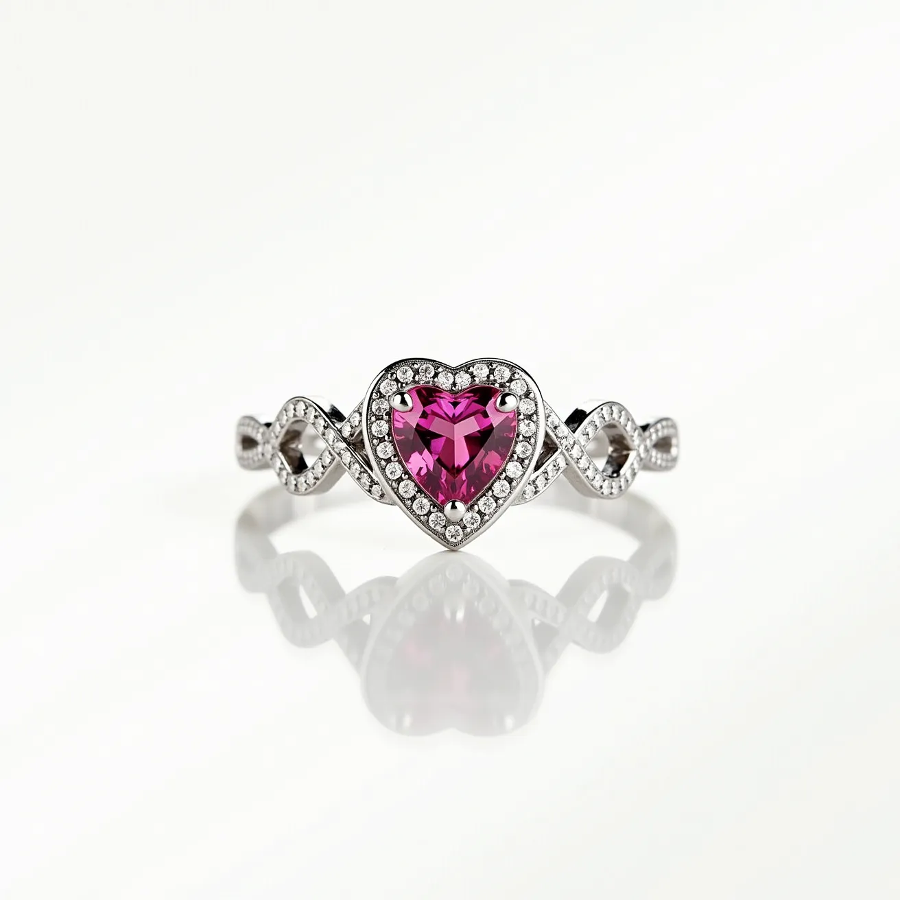 This pink heart ring features a central heart-shaped gem of vibrant pink hue, possibly a sapphire or tourmaline, which is expertly cut to enhance its brilliance and depth. The gemstone is set in a polished silver or white gold band, which provides a modern and sleek appearance. Surrounding the central stone is a halo of smaller round clear stones, likely diamonds, which accentuate the heart shape and add extra sparkle. The band of the ring is embellished with an elegant infinity motif, incorporating additional small clear stones for a cohesive and refined design. The ring does not appear to have any clasps or attachments, suggesting a traditional band style.