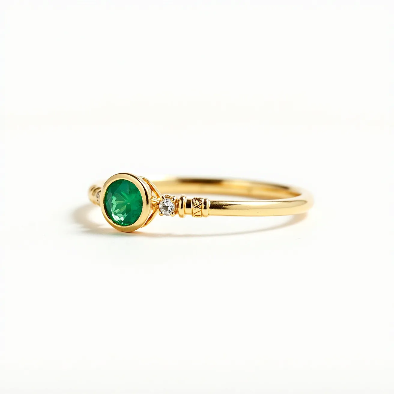 This pinky ring features a sleek and elegant design crafted from gold. At its center, it showcases a round, brilliant-cut green gemstone, likely an emerald, set in a bezel setting that accentuates its vibrant hue. Flanking the central stone is a small, sparkling round-cut diamond set in a prong setting, adding a touch of brilliance and contrast to the ring. The shank of the ring is adorned with subtle detailing, enhancing its overall sophistication and ensuring a comfortable fit, with no visible clasp or attachment mechanism as it is a traditional ring form.