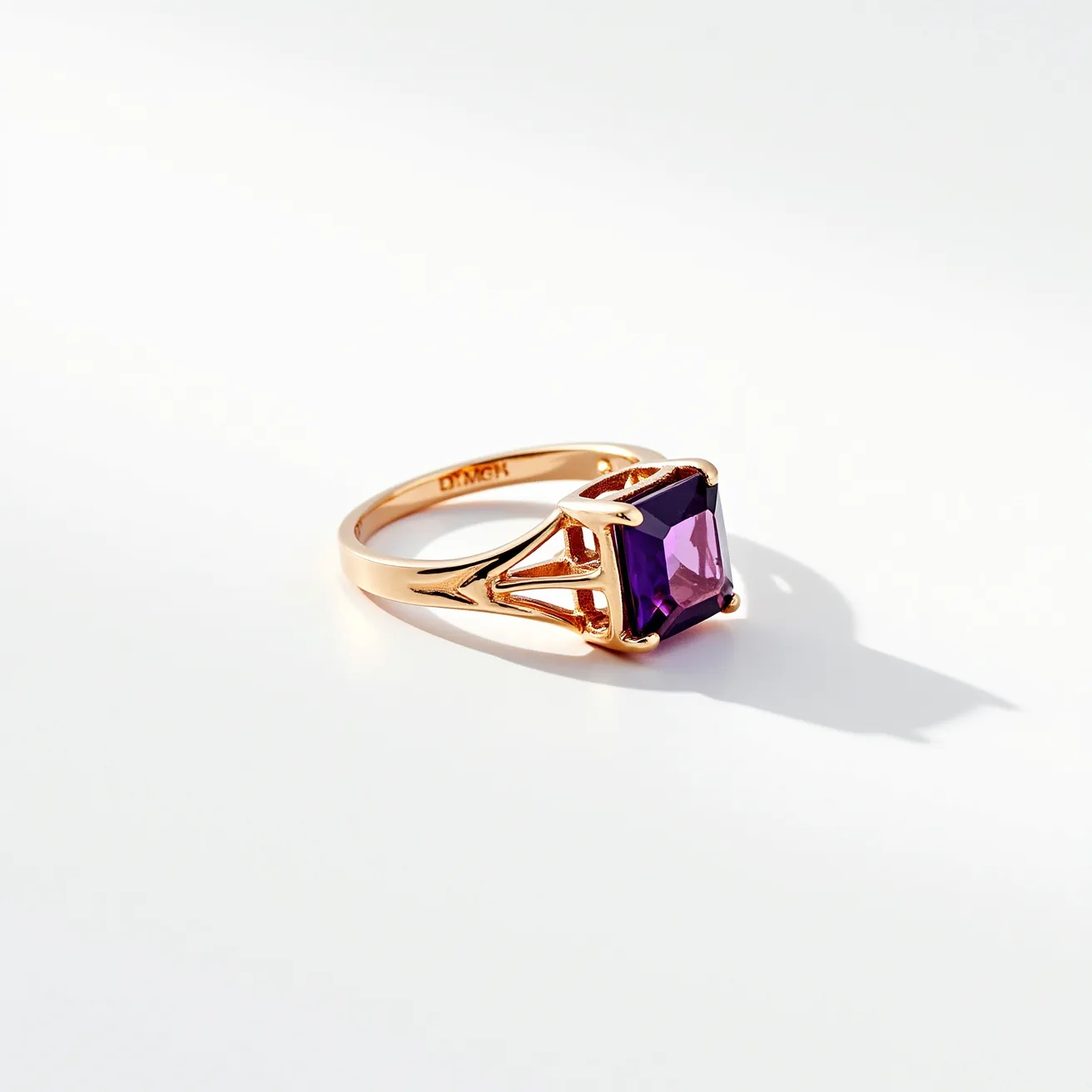 This pinky ring features a gold band with an intricate design that secures a stunning, square-cut amethyst stone as its centerpiece. The amethyst, with its rich purple hue, is held in place by a prong setting that accentuates its brilliance and clarity. The gold band elegantly complements the gemstone, with an open design that adds a modern touch to the classic piece. The setting and materials used showcase a blend of elegance and sophistication, making it a striking accessory for any occasion.