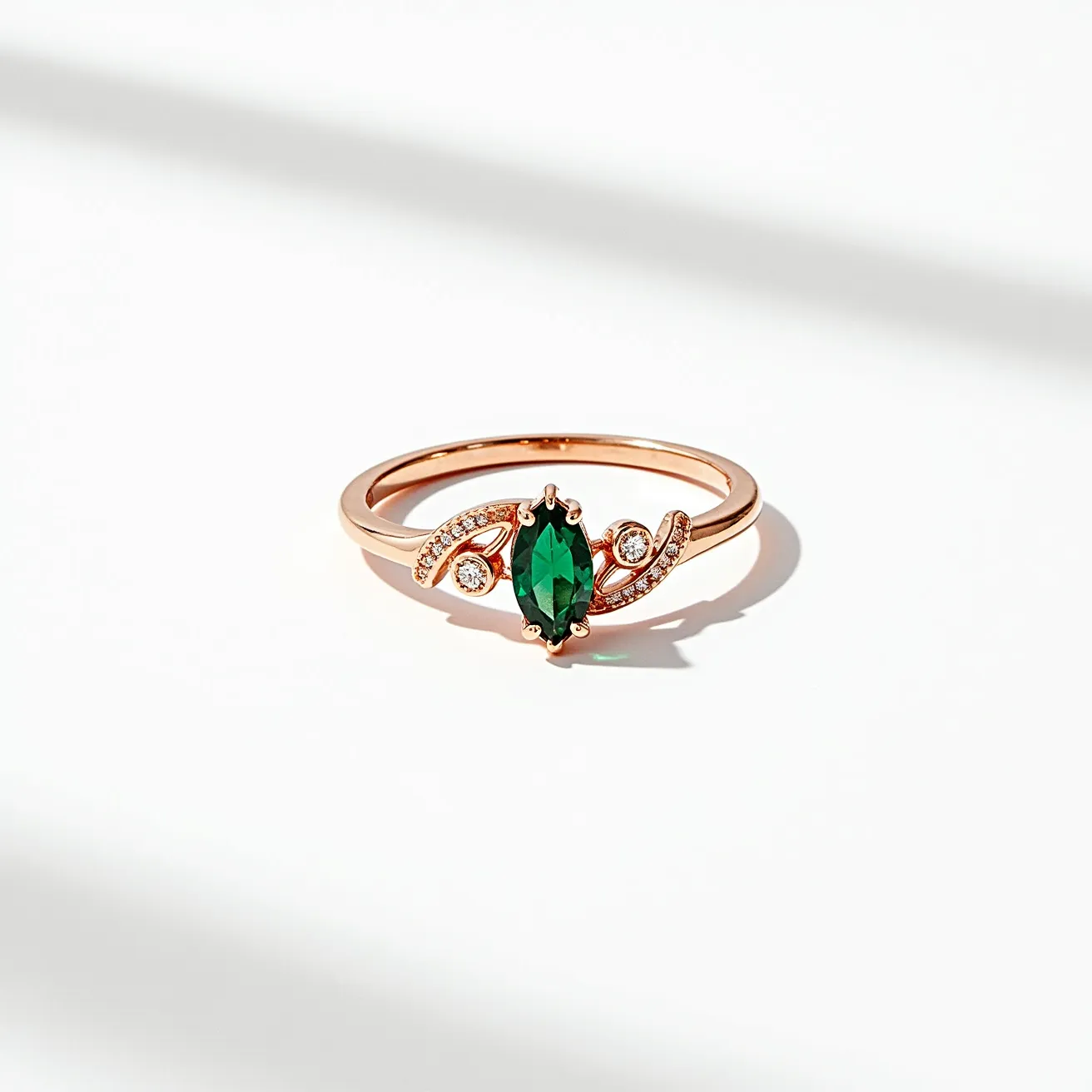 This prasiolite ring features a marquise-cut green prasiolite at its center, elegantly set in a prong setting that enhances its vibrant hue. The band is crafted from a warm rose gold, contributing to the overall elegance and sophistication of the piece. Flanking the central stone are delicate swirling accents encrusted with small round diamonds, adding a touch of sparkle and enhancing the ring's visual appeal. The design strikes a harmonious balance between the center prasiolite and the accent diamonds, creating a refined and eye-catching look.