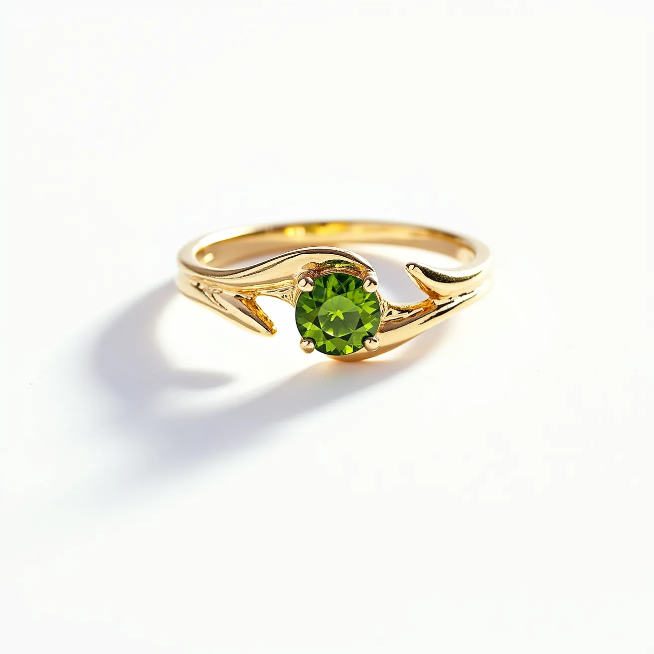 This prasiolite ring features a vibrant, round-cut green stone set in a gleaming gold band. The prasiolite is securely held by four prongs, showcasing its color and cut with elegance. The band displays a unique design, incorporating flowing, organic motifs that enhance the overall aesthetic of the piece. The combination of the gold and the green prasiolite creates a striking contrast, adding a touch of sophistication and charm to the ring.