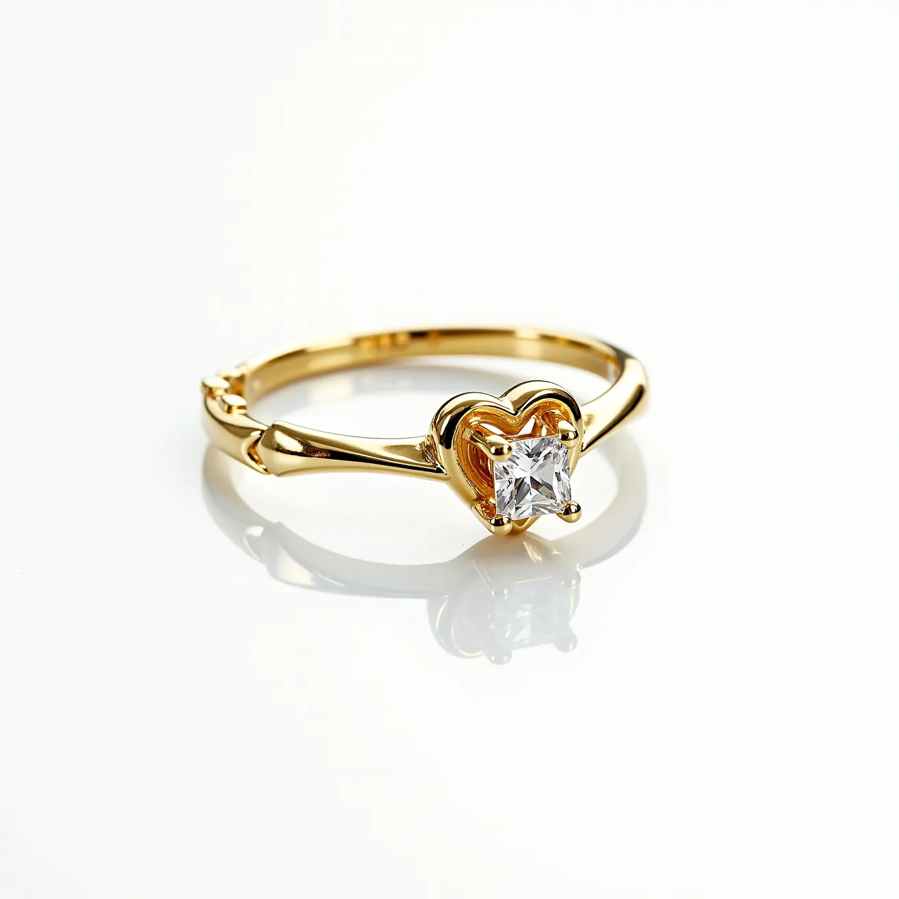 This promise ring features a gold band that elegantly supports a central gemstone set in a heart-shaped setting. The gemstone is a square-cut, clear stone, likely a diamond, securely held in place with prongs that accentuate its brilliance and clarity. The heart setting adds a romantic flair, highlighting the symbolism of commitment and affection associated with promise rings. The polished finish of the gold band complements the stone, creating a harmonious balance of luxury and sentiment.