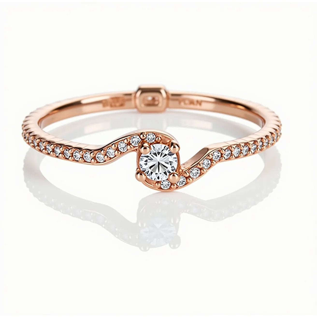 This promise ring features a delicate rose gold band adorned with small, round-cut diamonds along its perimeter, enhancing its elegance with a touch of sparkle. The centerpiece showcases a slightly larger, round-cut diamond in a prong setting that allows the stone to capture and reflect light beautifully. The band’s gentle curves integrate seamlessly with the central diamond, creating a harmonious flow between the gems and metal. The ring does not feature any additional clasp or attachment, maintaining a simple yet sophisticated design that signifies a commitment.