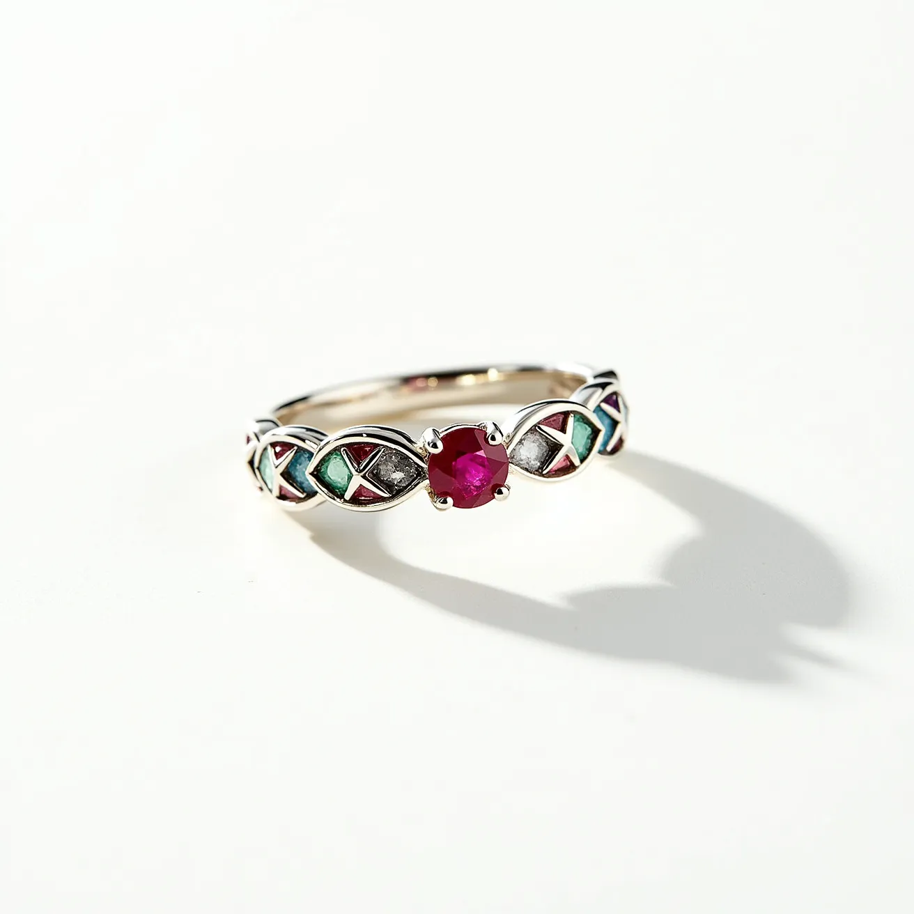 This rainbow ring features a polished metal band adorned with intricately designed multi-colored enamel inlays. At its center, there is a brilliant red gem, possibly a ruby, cut in a round shape and held securely in place by a four-prong setting. The band includes decorative elements that alternate with the enameled sections, creating a vibrant and eye-catching appearance. The combination of the colorful inlays and the central gem gives the ring a unique and sophisticated aesthetic.