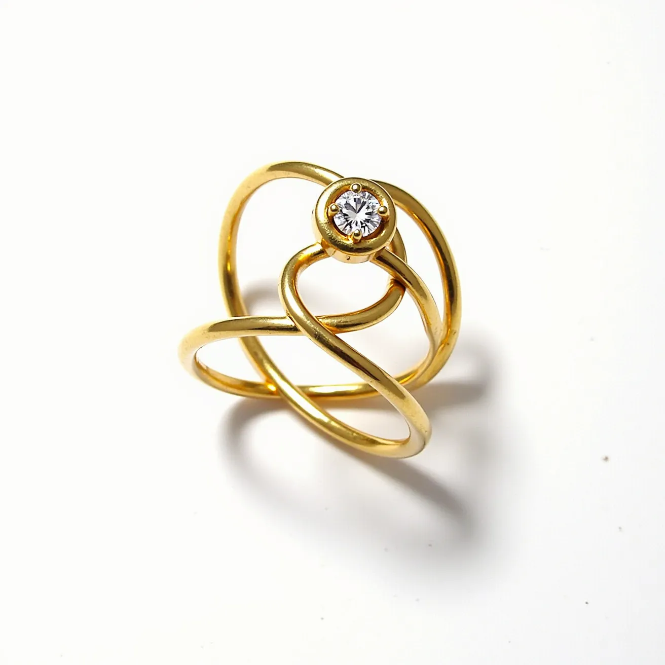 This Rapunzel ring features an intricate design crafted from a lustrous gold metal, forming a series of interwoven loops that elegantly encase the finger. At its center, the ring showcases a brilliant round-cut gemstone, securely held in place by a bezel setting that enhances its sparkle and prominence. The smooth, polished finish of the gold adds a touch of classic sophistication, while the overlapping bands create a sense of fluidity and movement. The overall design evokes a sense of timeless elegance, reminiscent of the iconic imagery associated with Rapunzel’s flowing locks.