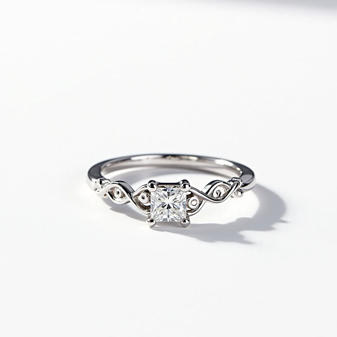 This Rapunzel ring is crafted from a polished metal that appears to be white gold or platinum, featuring a square-cut center stone that resembles a diamond, secured in a four-prong setting. The band is intricately designed with an elegant, flowing pattern that mirrors the whimsical, braided style reminiscent of Rapunzel's hair. Small round accents along the band add a touch of sophistication and sparkle, enhancing the central gemstone. The design seamlessly integrates the braided motif into the band, maintaining a cohesive and enchanting aesthetic.