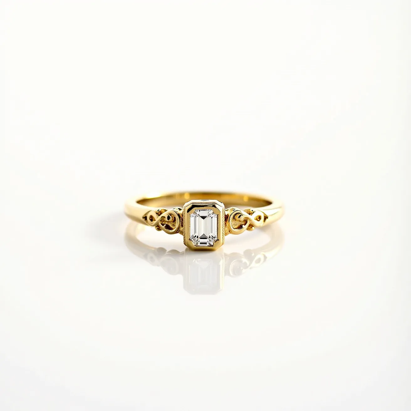 This ring band is crafted from a polished yellow gold material, featuring an intricately designed shank with delicate infinity motifs on either side of the central gemstone. The centerpiece is a rectangular emerald-cut gem, likely a diamond, that is securely set within a four-prong setting, enhancing its brilliance and elegance. The overall design combines classic elements with a touch of intricate detailing, making it a sophisticated piece of jewelry.