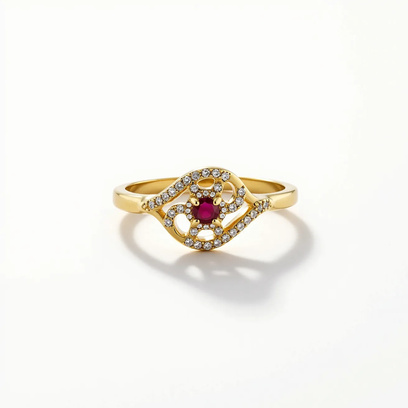 This signet ring features a refined gold band adorned with an intricate design that showcases a central round-cut red gemstone, likely a ruby, set in place as the focal point. Surrounding the central stone, smaller round-cut diamonds are meticulously arranged in a pavé setting, adding an elegant sparkle that enhances the overall luxurious appearance. The gold band, polished to a high shine, complements the brilliance of the stones, creating a striking contrast that highlights the craftsmanship and attention to detail. The design is both modern and timeless, making it a versatile piece suitable for various occasions.