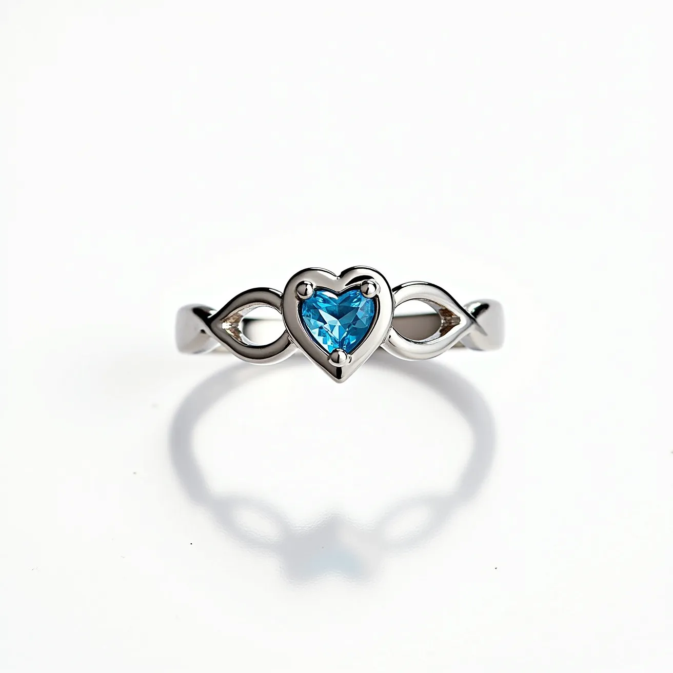 This silver heart ring features a graceful band made of polished silver, with an elegant open design that accentuates its ethereal appearance. At its center, a captivating heart-shaped blue gem is set, showcasing a precise cut that enhances its sparkle. The gem is securely held within a prong setting, allowing maximum light to enter and reflect brilliantly off its facets. The design is cohesive and flows seamlessly, creating an enchanting piece of jewelry without the need for additional clasps or attachments.