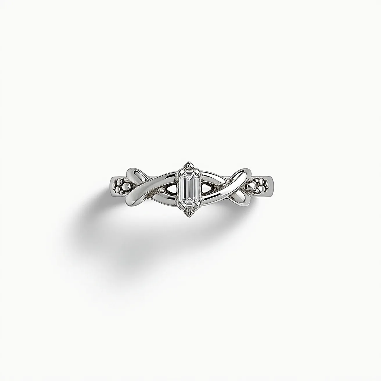 This silver ring features an elegant design with a prominent emerald-cut gemstone at its center, held securely in a prong setting. The band showcases an intricate, intertwined pattern that adds a unique flair to the overall design. Delicate embellishments on the sides of the setting enhance its sophisticated and polished look.