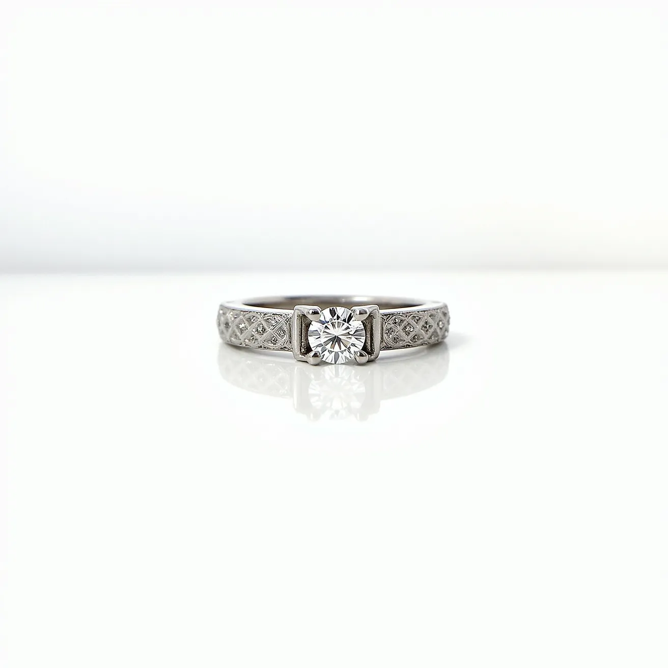 This silver wedding ring features an intricately designed band with a delicate pattern that adds texture and elegance. At its center, the ring holds a prominent round-cut gem set in a classic four-prong setting, enhancing the stone's brilliance and allowing light to reflect beautifully through it. The polished silver adds a sophisticated sheen, complementing the central gem's sparkle. The overall design is both timeless and modern, with a focus on showcasing the central stone's clarity and cut. The craftsmanship and attention to detail highlight the ring's significance as a symbol of enduring commitment.