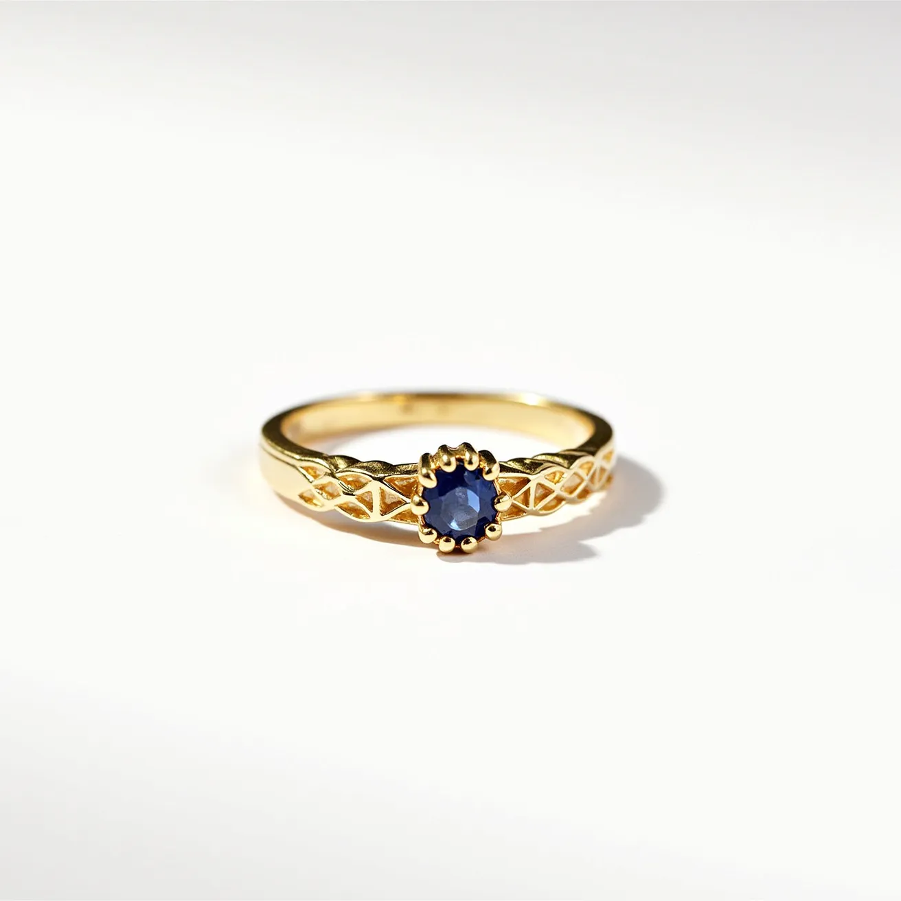 This solomon's ring features a richly crafted gold band with intricate lattice-style detailing along its sides. At its center is an oval-shaped blue sapphire, securely set in a bezel crown setting that elegantly showcases the stone's depth and brilliance. The sapphire's deep blue hue contrasts beautifully against the warm glint of the gold, enhancing its regal appearance. This combination of meticulously chosen materials and expert craftsmanship imbues the ring with a timeless elegance and a sense of mystique.