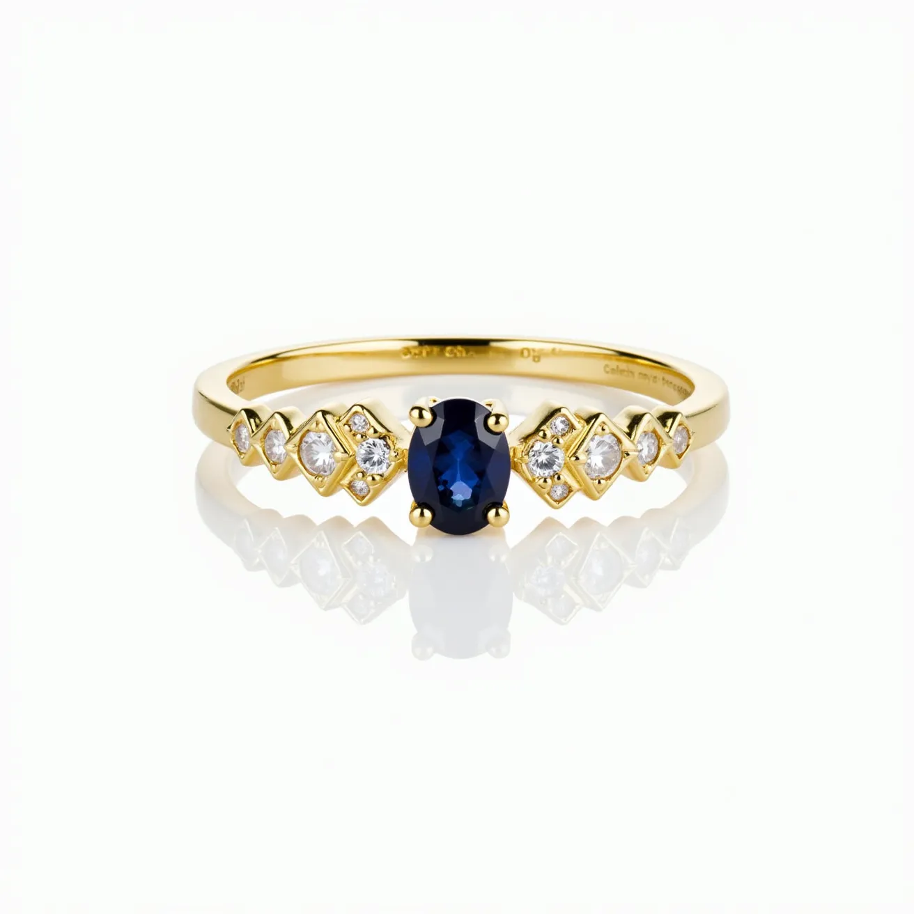 This stackable diamond ring features a lustrous gold band that elegantly showcases an array of gemstones. At the center, an oval-cut sapphire is set within a four-prong setting, drawing attention with its deep blue hue. Flanking the central stone on each side, a series of small round-cut diamonds are set, each encased in a bezel-like diamond-shaped gold setting that complements the overall design. The combination of the vibrant sapphire with the sparkling diamonds and radiant gold creates a harmonious and stylish piece that is both versatile and luxurious.