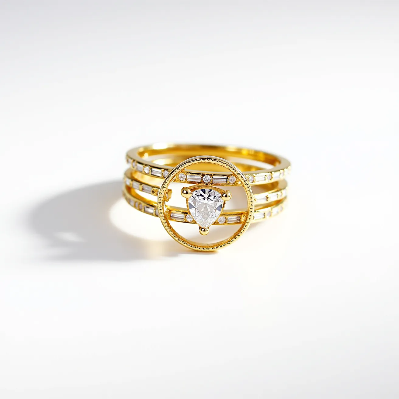 This stackable diamond ring features a multi-band design crafted from gold, which provides a luxurious and elegant base. The ring showcases a prominent pear-cut diamond set in the center, held securely within a circular gold frame. The bands are further embellished with alternating round and baguette-cut diamonds, adding sparkle and sophistication. The setting and overall design are sleek and minimal, allowing the brilliance of the diamonds to stand out. The stackable nature of the ring allows for versatility in styling, making it a standout piece suitable for various occasions.